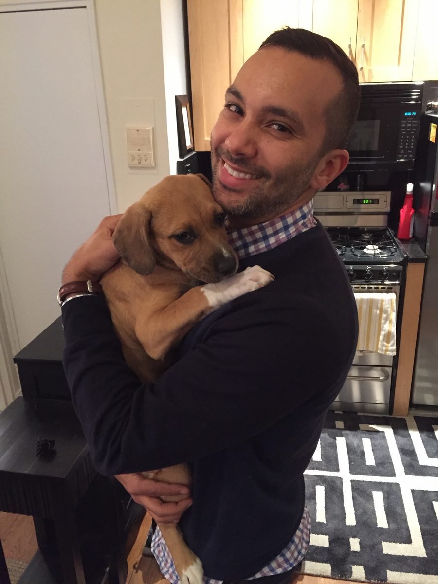 Eddie holding Maya as a puppy